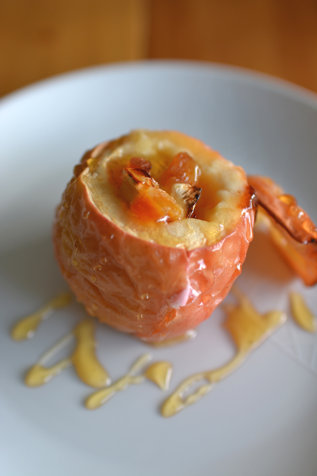 close-up view of a freshly baked dinner  cheese and apple drizzled with honey