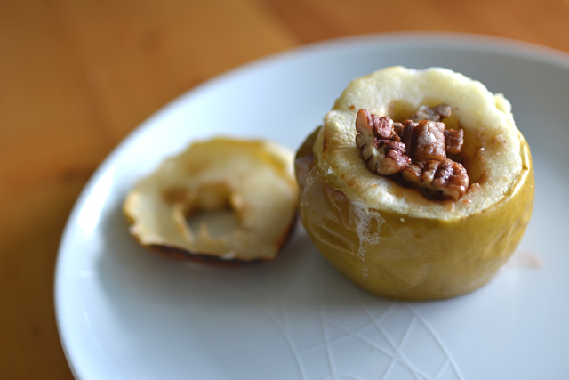 close-up view of a freshly baked pecan apple with visible pecans on top