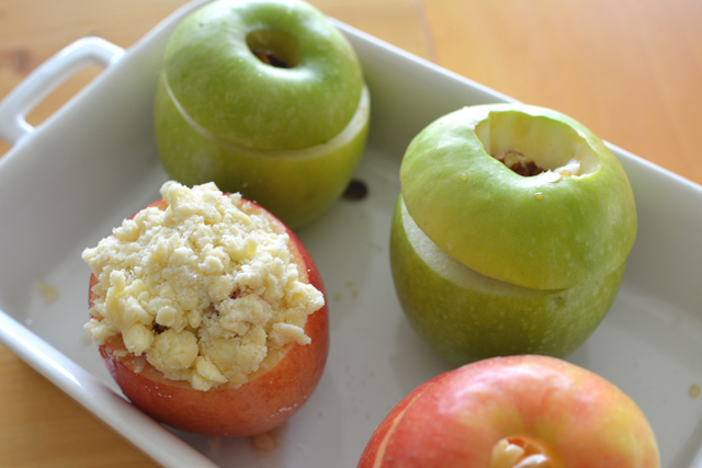 close-up of fresh apples with toppings, ready to be baked