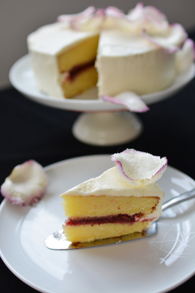 close-up image capturing a single slice of raspberry rose cake