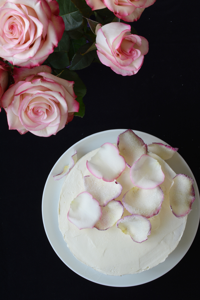 top view image of the raspberry rose cake top with rose petals