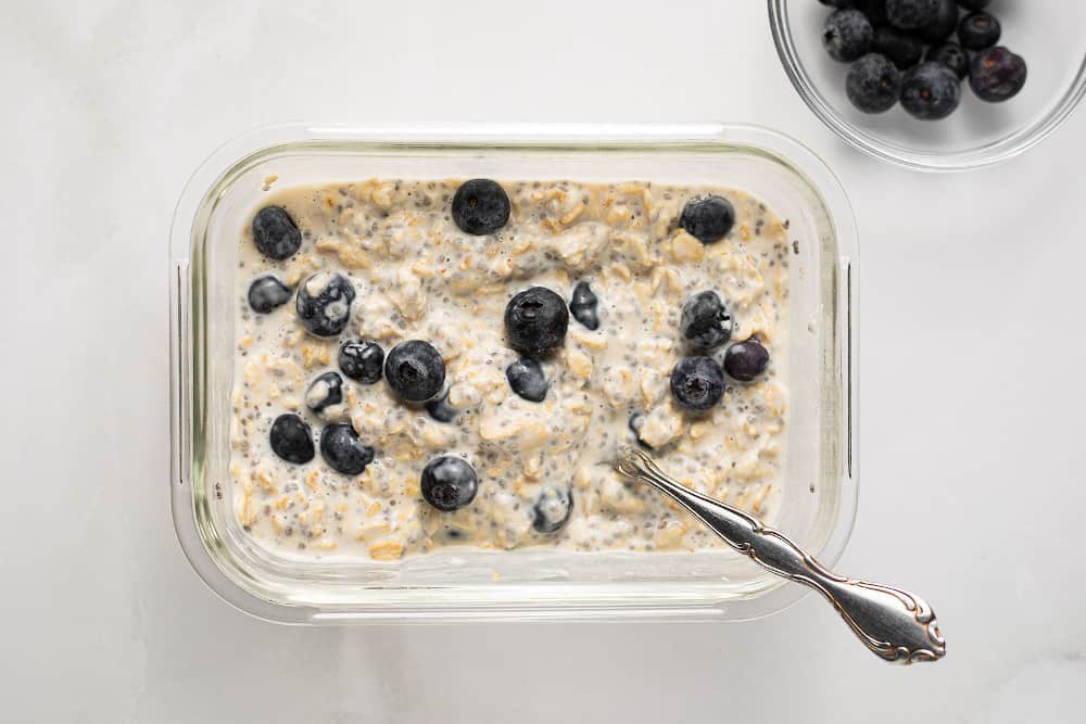 Blueberry Overnight Oats in a glass container, ready to eat.