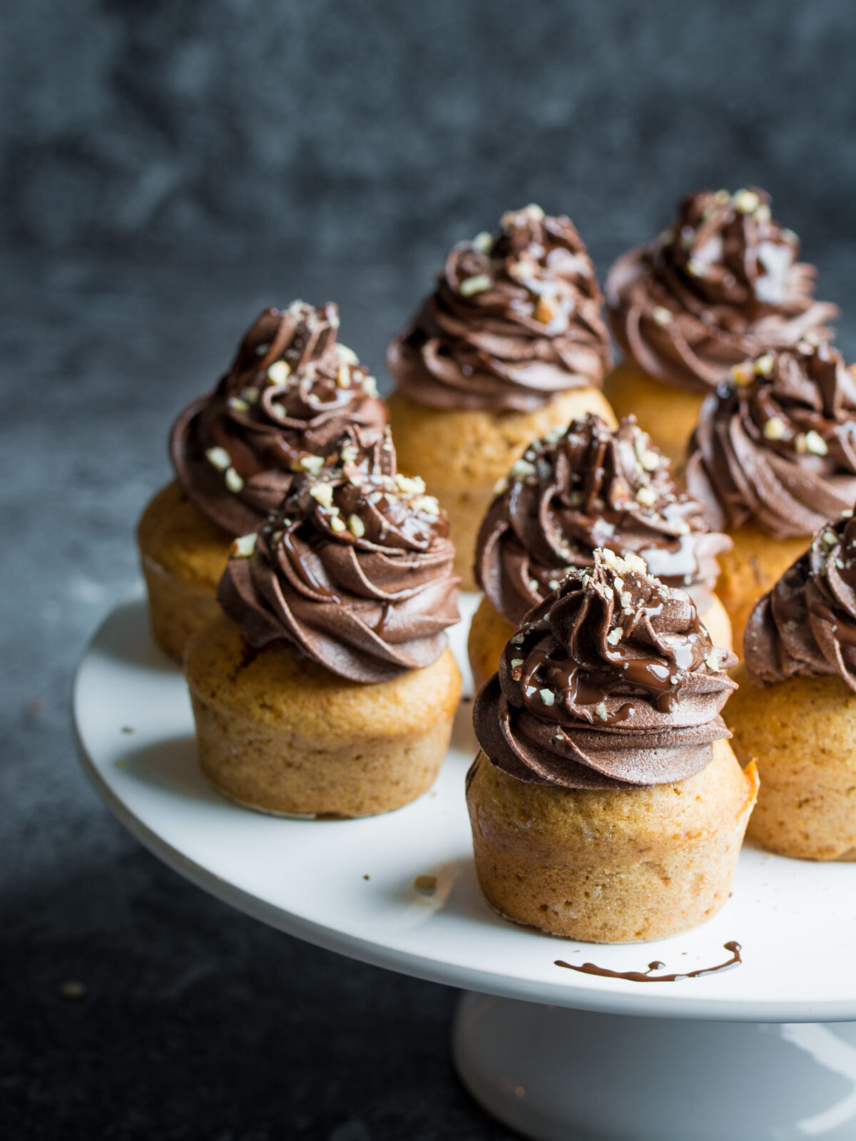 These Vegan Chocolate and Ginger cupcakes are moist, fluffy and absolutely delicious! Your friends would NEVER guess they were vegan! Click through for the recipe!