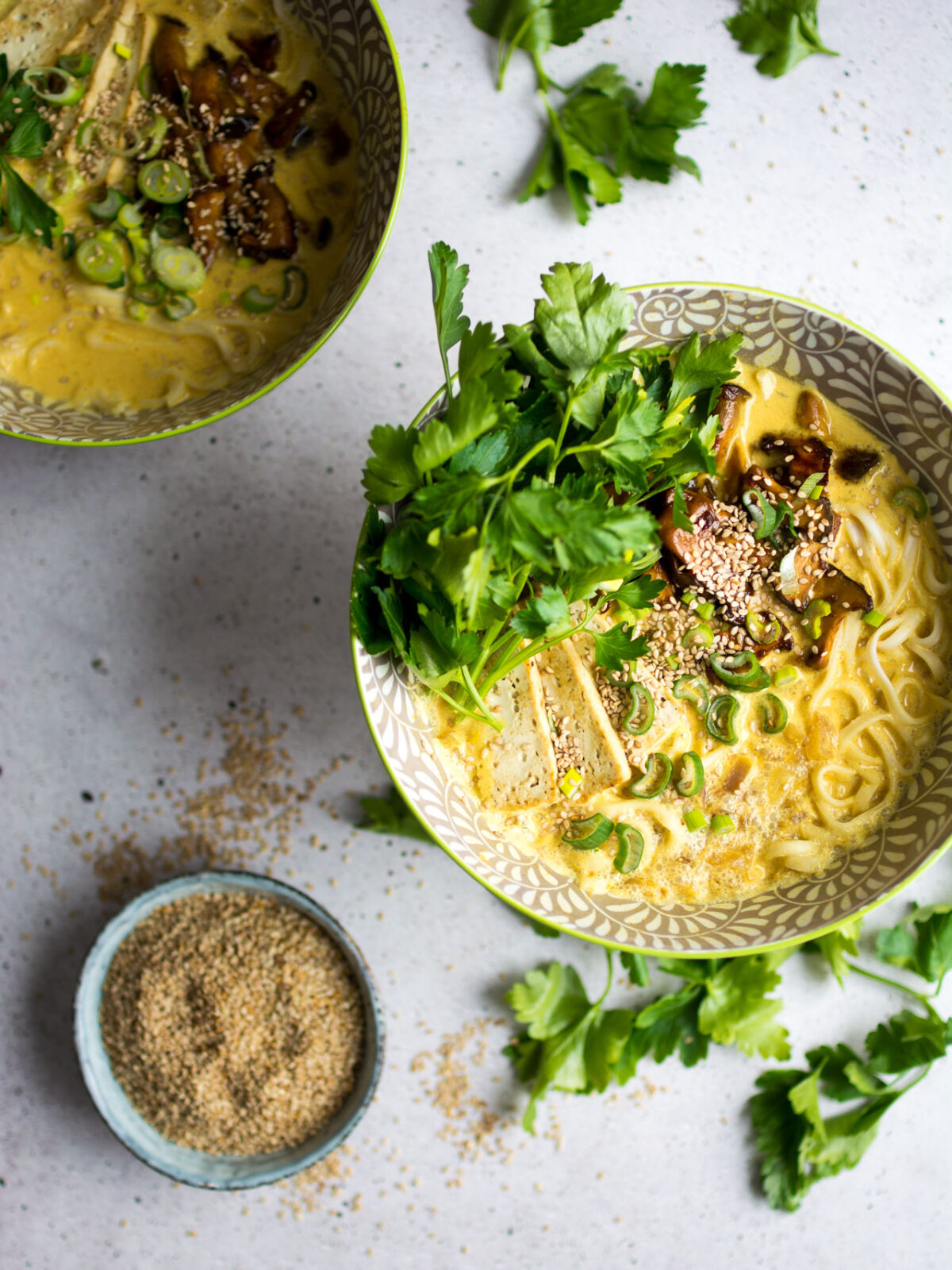 A rich, vegan, coconut curry ramen bowl, with marinated mushrooms and crispy tofu!