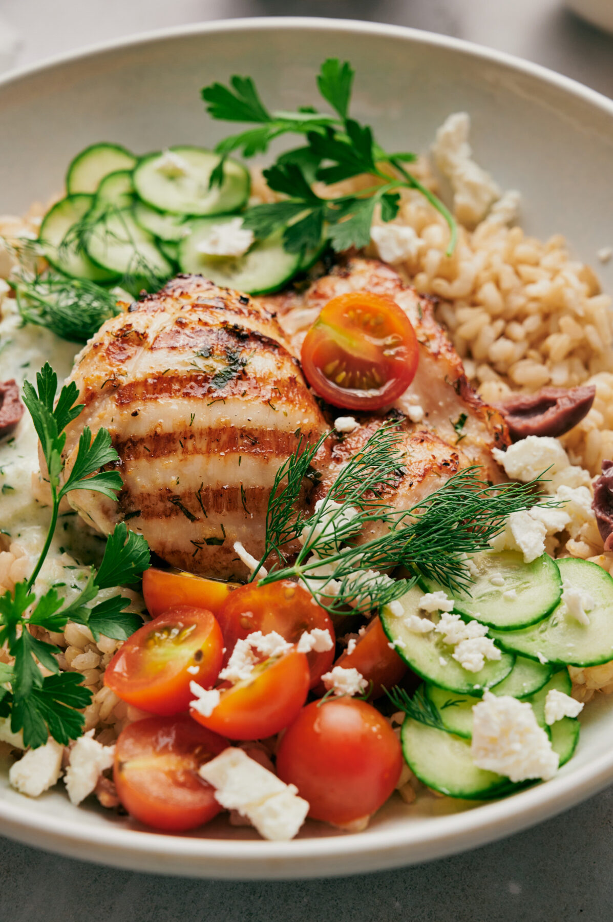 Vertical view of a Greek Chicken Bowl.