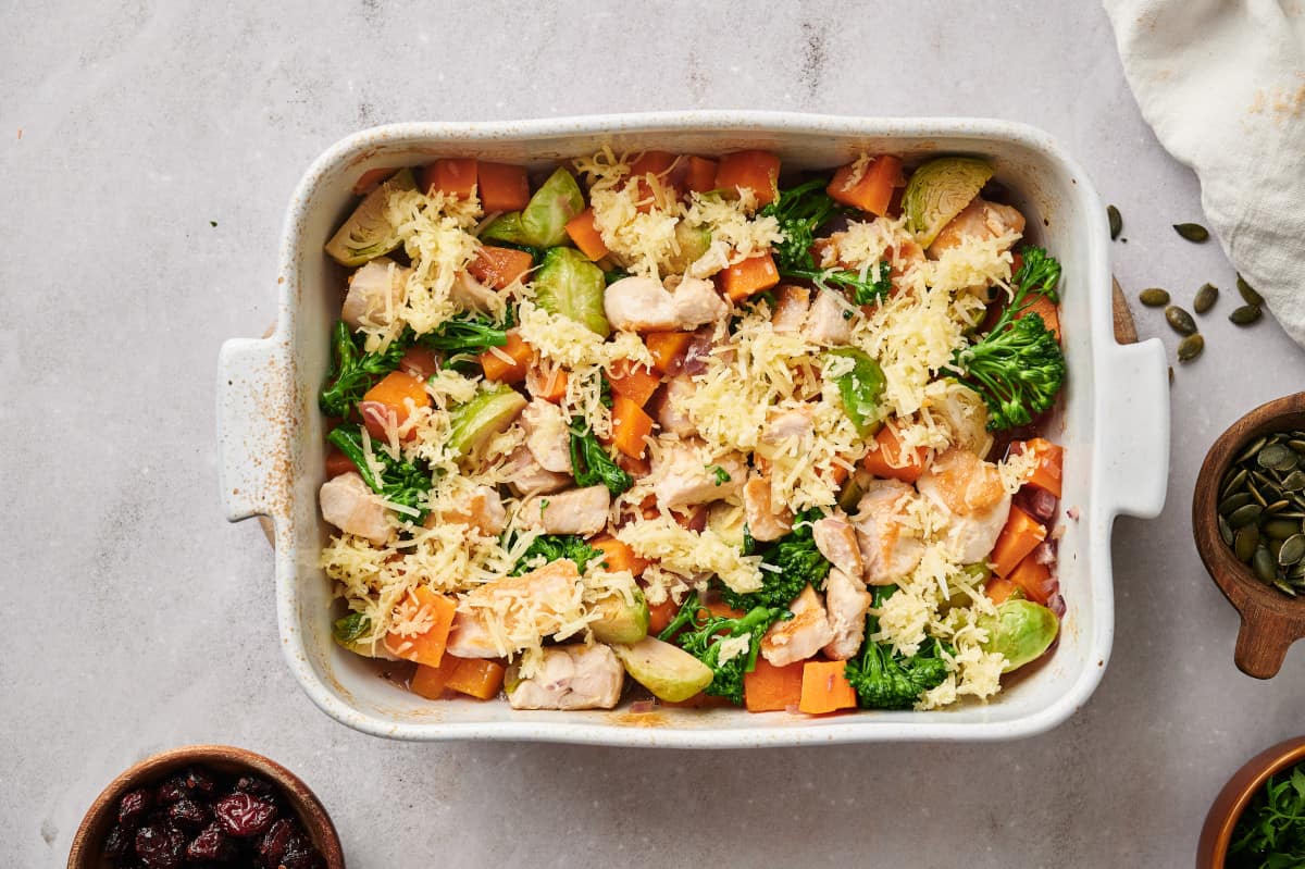 Harvest Chicken Casserole topped with cheese, just before being placed back into the oven.