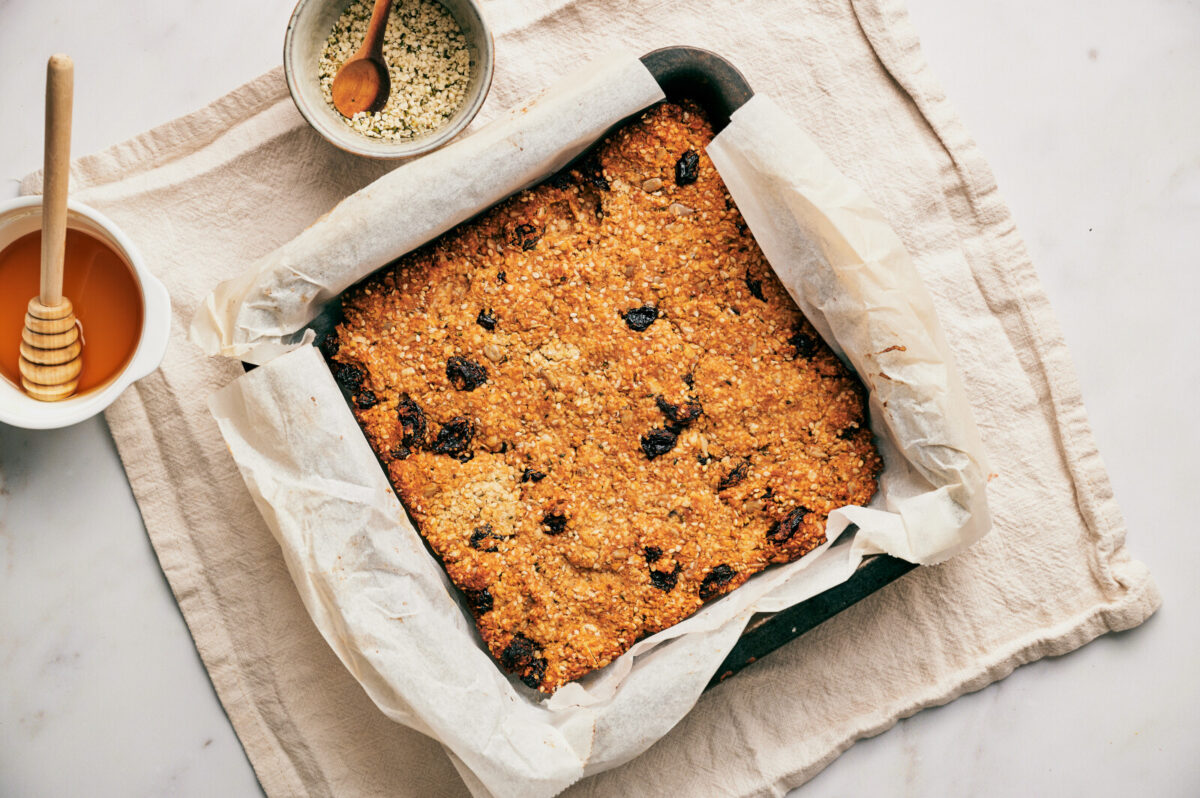 Fresh baked homemade granola bars, golden brown after coming out of the oven.