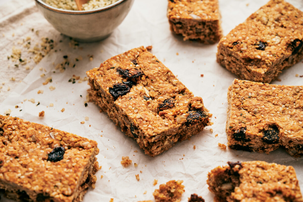 Close-up of homemade granola bars cut up into rectangles.