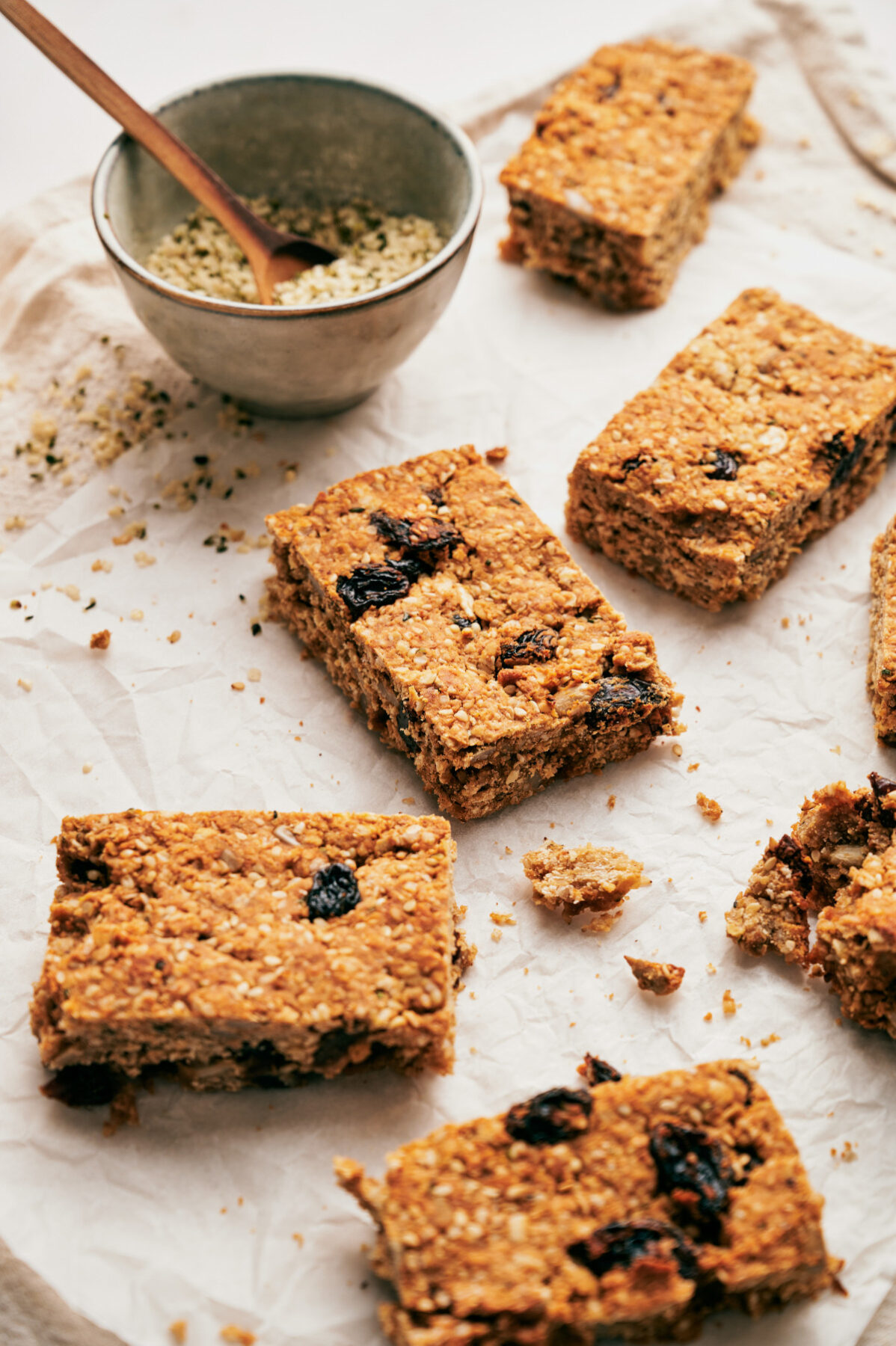 Homemade granola bars cut up into rectangles (vertical shot).