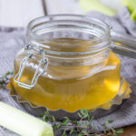 cropped image showcasing a glass canister filled with flavorful homemade vegetable stock