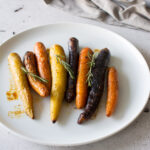 Complete your Roast dinner with these perfectly Honey Roasted Carrots with Rosemary. Crispy, soft and sweet, these carrots will compete with the main event at your next dinner!