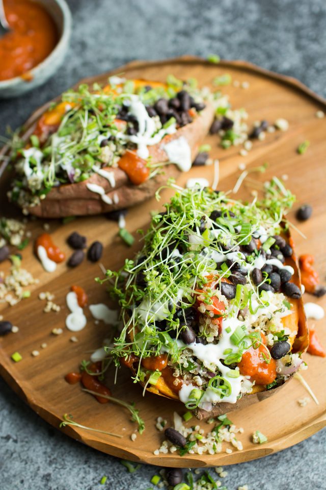 Loaded Sweet Potatoes with Quinoa Tabbouleh. Healthy and totally vegan, these baked sweet potatoes are topped with fresh, vibrant ingredients for a great, satisfying meal!