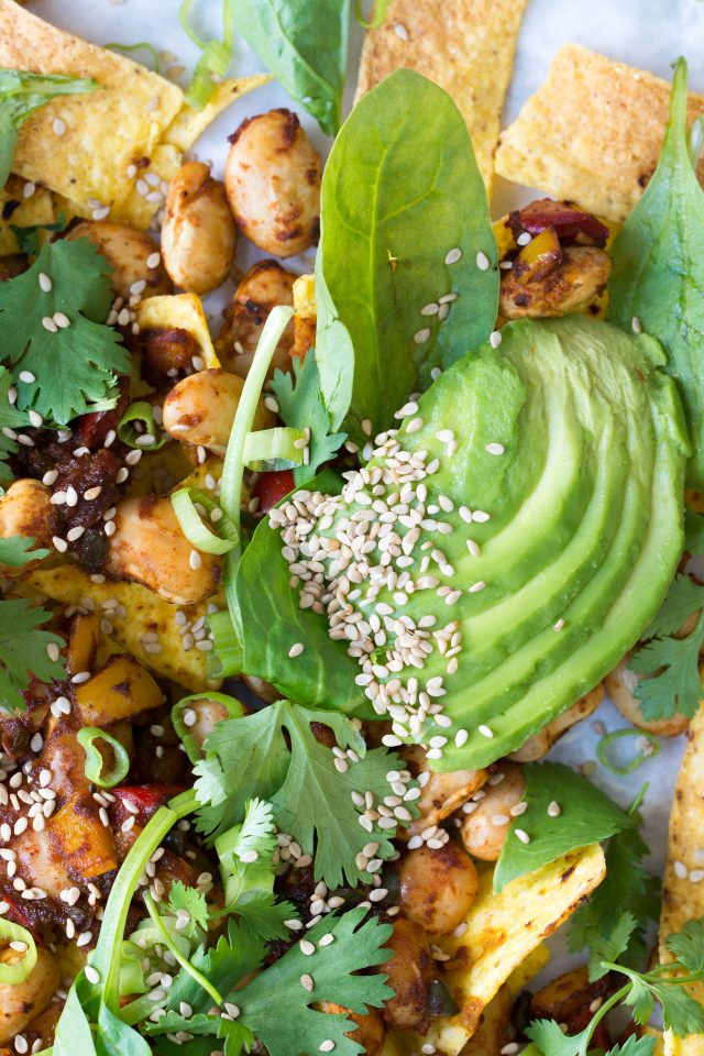 Loaded Vegan Nachos with Harissa Beans, the perfect easy snack for a hot summer's day!