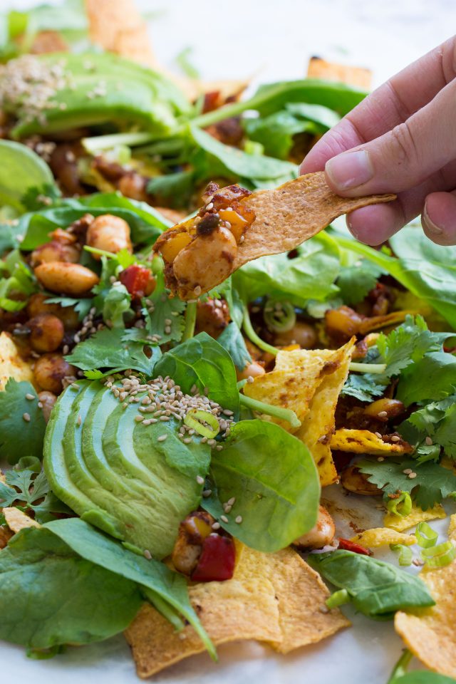 Loaded Vegan Nachos with Harissa Beans, the perfect easy snack for a hot summer's day!