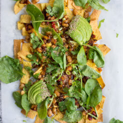 Loaded Vegan Nachos with Harissa Beans, the perfect easy snack for a hot summer's day!