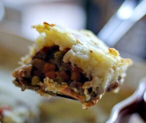 A slice of shepherd's pie on a spatula.