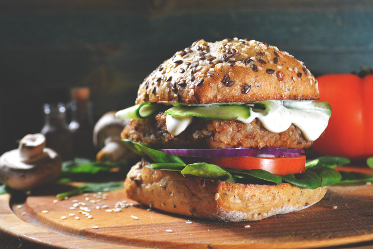 A plant-based burger on a multi-grain bun.