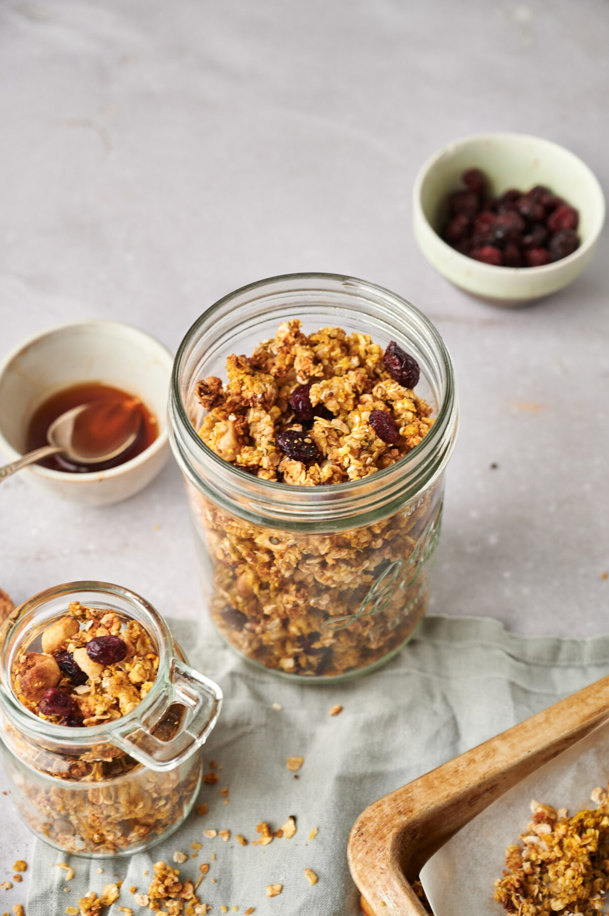 Pumpkin Spice Granola with dried cranberries in a mason jar.