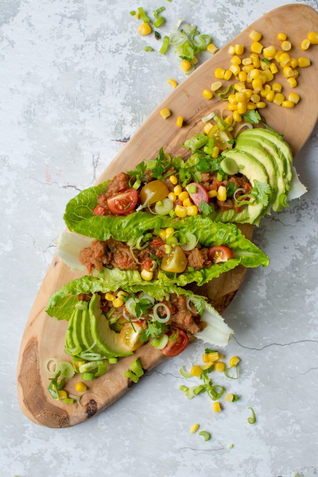 Refried Bean Lettuce wraps, perfect for a vegan lunch on the go, or just a lighter dinner option! Get this super easy recipe here!