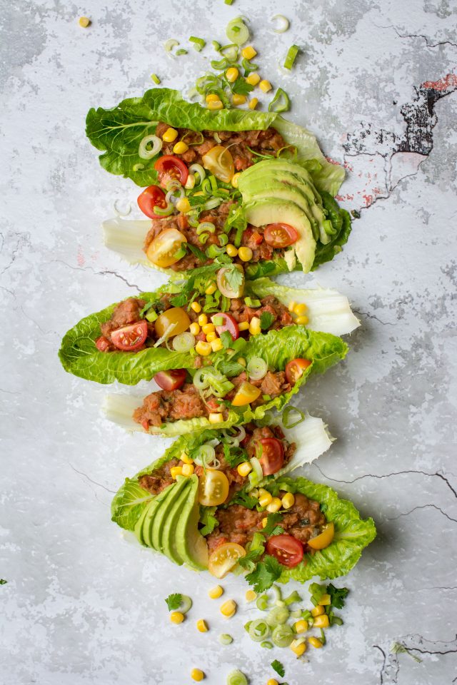 Refried Bean Lettuce wraps, perfect for a vegan lunch on the go, or just a lighter dinner option! Get this super easy recipe here!