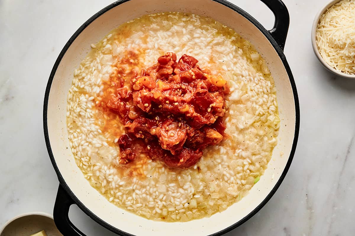 Roasted tomatoes and garlic added to the thickened risotto.