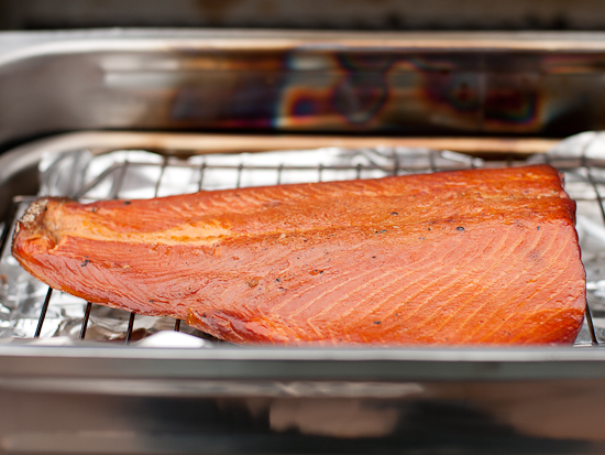 Hot smoked salmon sitting in a stovetop smoker.