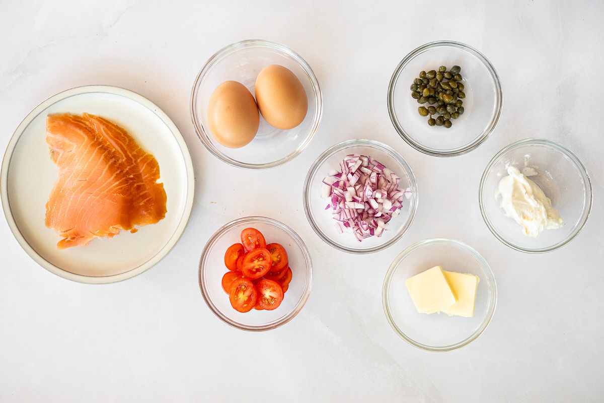 Smoked salmon omelet ingredients in bowls.