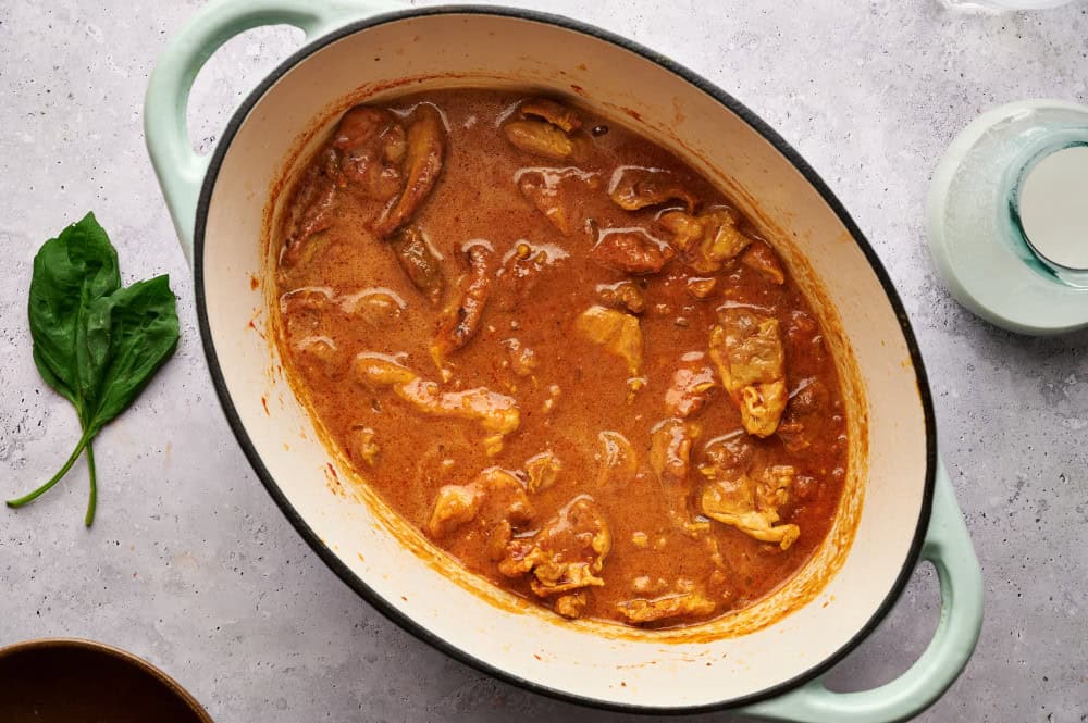 Thai Chicken Coconut Curry with all ingredients added, cooked in a Dutch oven.